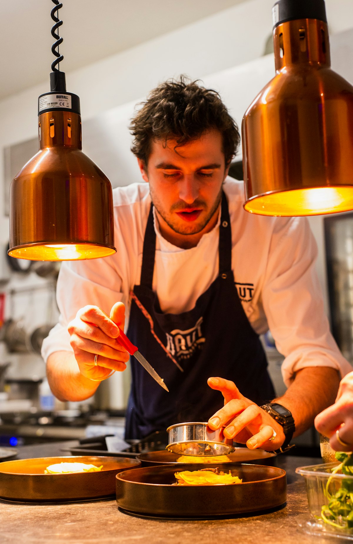 Head chef preparing a dish